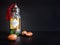 Decorative bottle with iron embossed in traditional Moroccan style with precious Moroccan argan oil and argan nuts on a