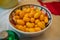 Decorative bowl filled with kumquats at a holiday table