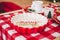 decorative bowl in red and white with the inscription merry christmas focusing the camera