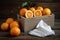 Decorative box of tissues and fresh oranges on a rustic table