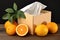 Decorative box of tissues and fresh oranges on a rustic table