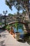 Decorative bridge and plants in pots. Landscape