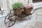 Decorative cart with baskets and flowers on the street