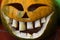 Decorative carved gouged out Halloween pumpkin as Jack-o`-lantern, smiling with large teeth