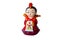 A decorative ceramic Korean figure, a female in traditional colorful clothes Han bock.