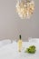 Decorative chandelier and bottle of wine on the table