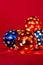 Decorative Christmas glowing garland lights multi-colored balls with star shaped holes.