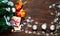 Decorative Christmas snowflakes and wooden sleighs.Holiday wooden background with christmas gift boxes and fir tree, top view.