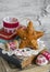 Decorative Christmas star, old books, paper molds for baking on a light wooden surface