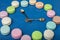 Decorative clock. Colored cookies, macaroni and decorative spoons