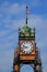 Decorative clock tower against a blue sky