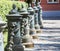 Decorative columns with lions and chains.