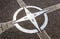 Decorative compass on the cement ground.