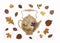 Decorative composition of handmade paper teapot and fall dry leaves on white background