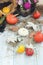 Decorative composition of pumpkins, seasonal vegetables, autumn leaves, illumination
