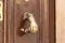 Decorative  copper handle in the form of a human hand on the outer door of a building on the Via Dolorosa Street in the old city