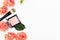 Decorative cosmetic product and make-up brush set. Pink face blush in open square case and maquillage tool with blooming roses