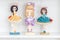 Decorative Cute Dolls on White Wooden Background on White Wooden