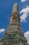 Decorative details of a golden prang at Emerald Buddha temple in Bangkok, Thailand in the Grand Palace complex