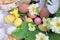 Decorative easter eggs hidden  in spring flowers in the garden