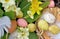 Decorative easter eggs hidden  in spring flowers in the garden