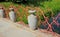 Decorative fence of stone amphorae and interwoven branches