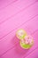 Decorative figure eight on pink wooden background