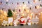 Decorative figures of Santa, snowmen, New Year tree, wooden Christmas train and others. Festive idea with toys