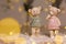 Decorative figurines of a Christmas theme. Figurines of cute teddy bears of a boy and a girl in sweaters with deers. Festive decor