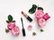 Decorative flat lay composition with cosmetics and flowers