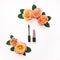 Decorative flat lay composition with cosmetics and flowers. Top view