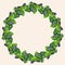 Decorative floral wreath from watercolor drawings of blooming purple flowers in green leaves