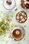 Decorative gingerbread cookie, chamomile flower, cup of tea