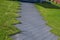 Decorative gray path laid out on the lawn