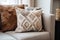 decorative handmade pillows on a neutral-toned couch
