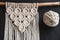 Decorative handmade stylish cotton macrame decoration, hobby interior for hanging on wall