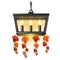 Decorative hanging wall lamp or a sconce with bulbs form of candles with leaves. Element of interior design on theme of