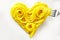 Decorative heart of coiled cooked spaghetti