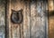 Decorative horseshoe on a wooden wall