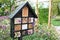 Decorative Insect house with compartments and natural components.