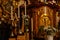 Decorative interior of church St. Henry and St. Kunhuty, gilded ornamented baroque altar, white flowers, tall candles, marble