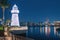 decorative lighthouse near the parking lot of yachts and ships in the Dubai Creek Marina Harbor. Travel and tourist