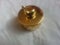 The decorative little golden pot with dolphin lid open, for room decoration