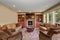 Decorative living room with leather sofas, and a rug.