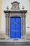 Decorative massive blue side door on late baroque Basilica of Our Lady of Seven Sorrows in Sastin Straze, western Slovakia