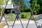 Decorative metal fence, behind which the house and the garden are visible blurred