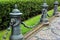 Decorative metal fence with lion heads and spiky metal chain