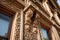 decorative molding and carvings adorn the exterior of a historic building