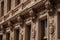 decorative molding and carvings adorn the exterior of a historic building