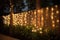 Decorative night garden wedding outdoor in garden with warm glow string lights. Generative AI